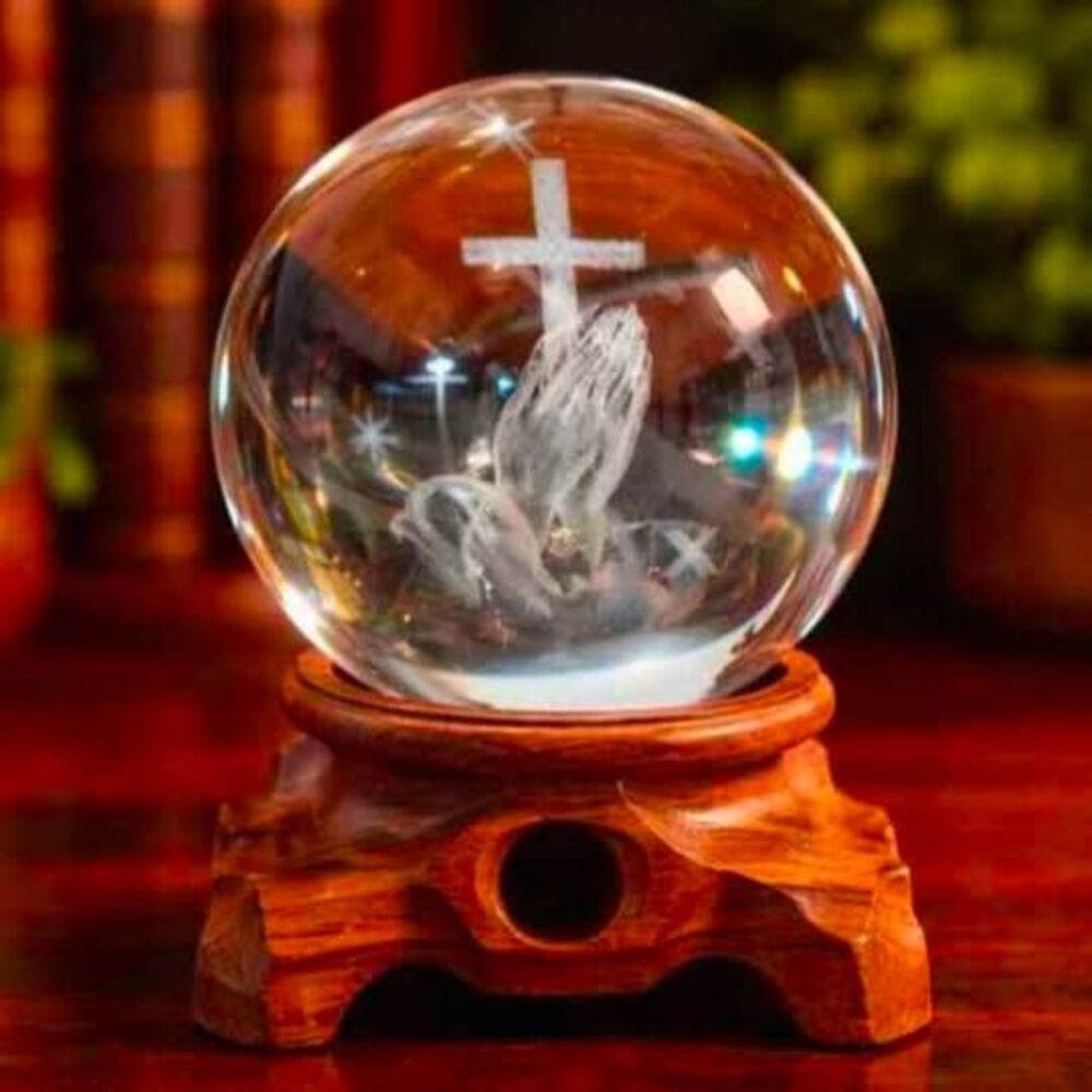 New Miniature 3" glass gazing ball with praying hands on wooden stand. 
Porch pi